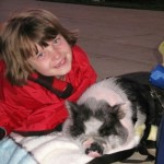 girl and pot bellied pig